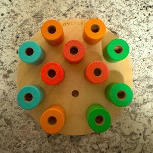 Lovevery wooden stacking pegboard
